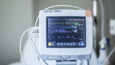 Medical vital signs monitor instrument in a hospital. This health care device displays and monitors heart rate and oxygen levels in hospital patients