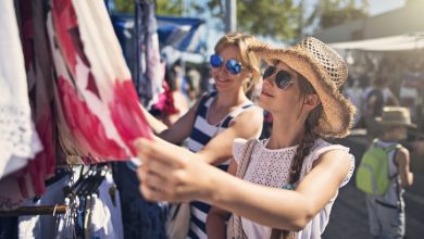 Mother and daughter buying clothes on flea market in Andalusia, Spain