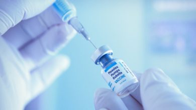 Medical worker prepareing measles, mumps and rubella vaccine for vaccination